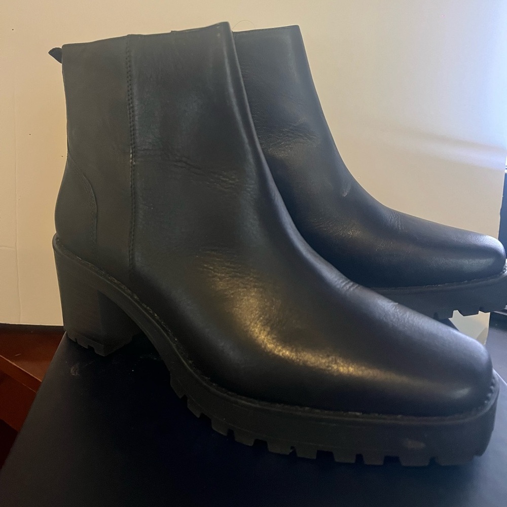 Women's Black Ankle Boots NEW in box. NEVER WORN. Lugged sole.